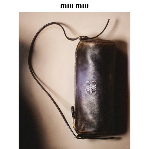 Miu Miu Embossed-Logo Cylinder Shoulder Bag