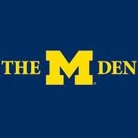 M Den